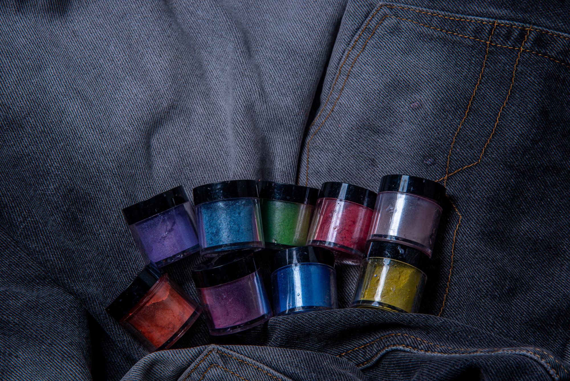 embroidery kit and color swatches next to a laptop